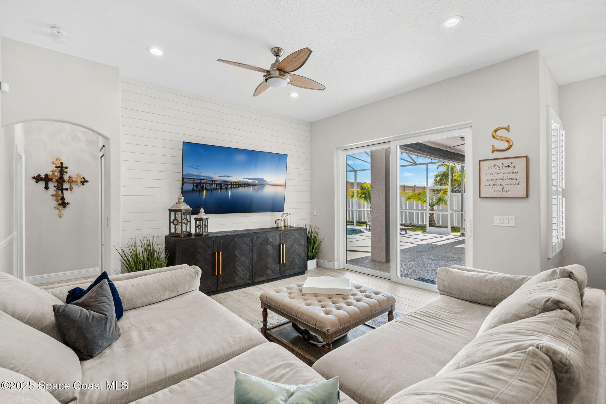 4440 Chardonnay Drive Rockledge, FL 32955 - Photo 12 of 41 a living room with furniture and a flat screen tv