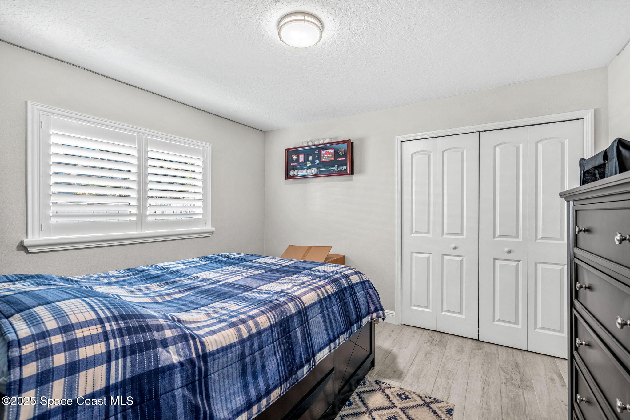 4440 Chardonnay Drive Rockledge, FL 32955 - Photo 19 of 41 a bedroom with a bed and a window