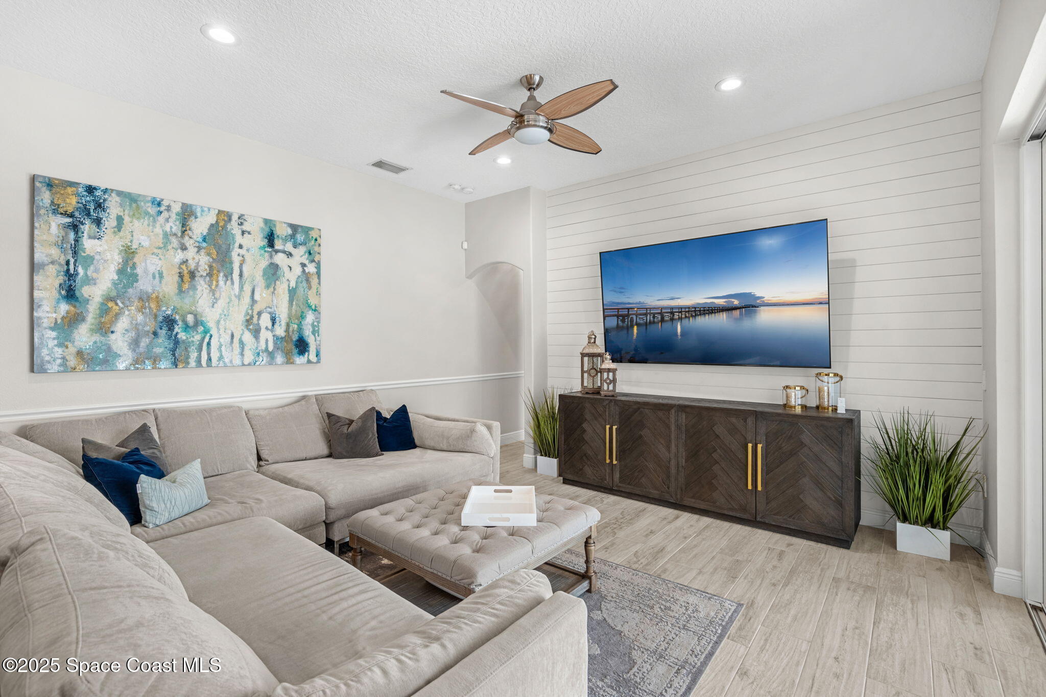 4440 Chardonnay Drive Rockledge, FL 32955 - Photo 31 of 41 a living room with furniture and a wooden floor