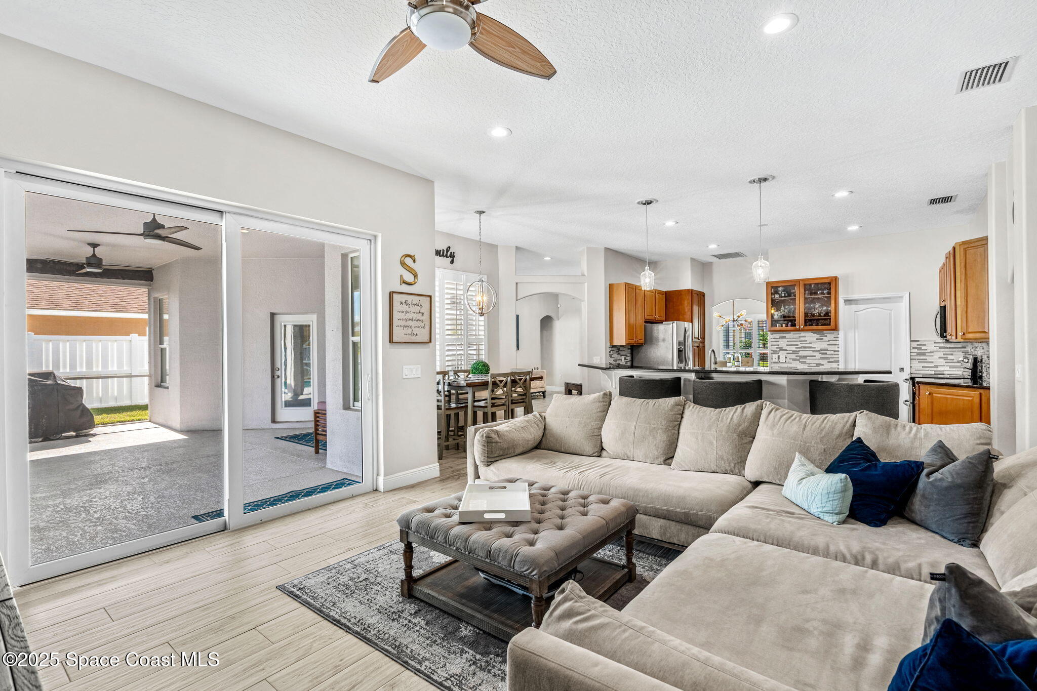 4440 Chardonnay Drive Rockledge, FL 32955 - Photo 32 of 41 a living room with furniture and a large window