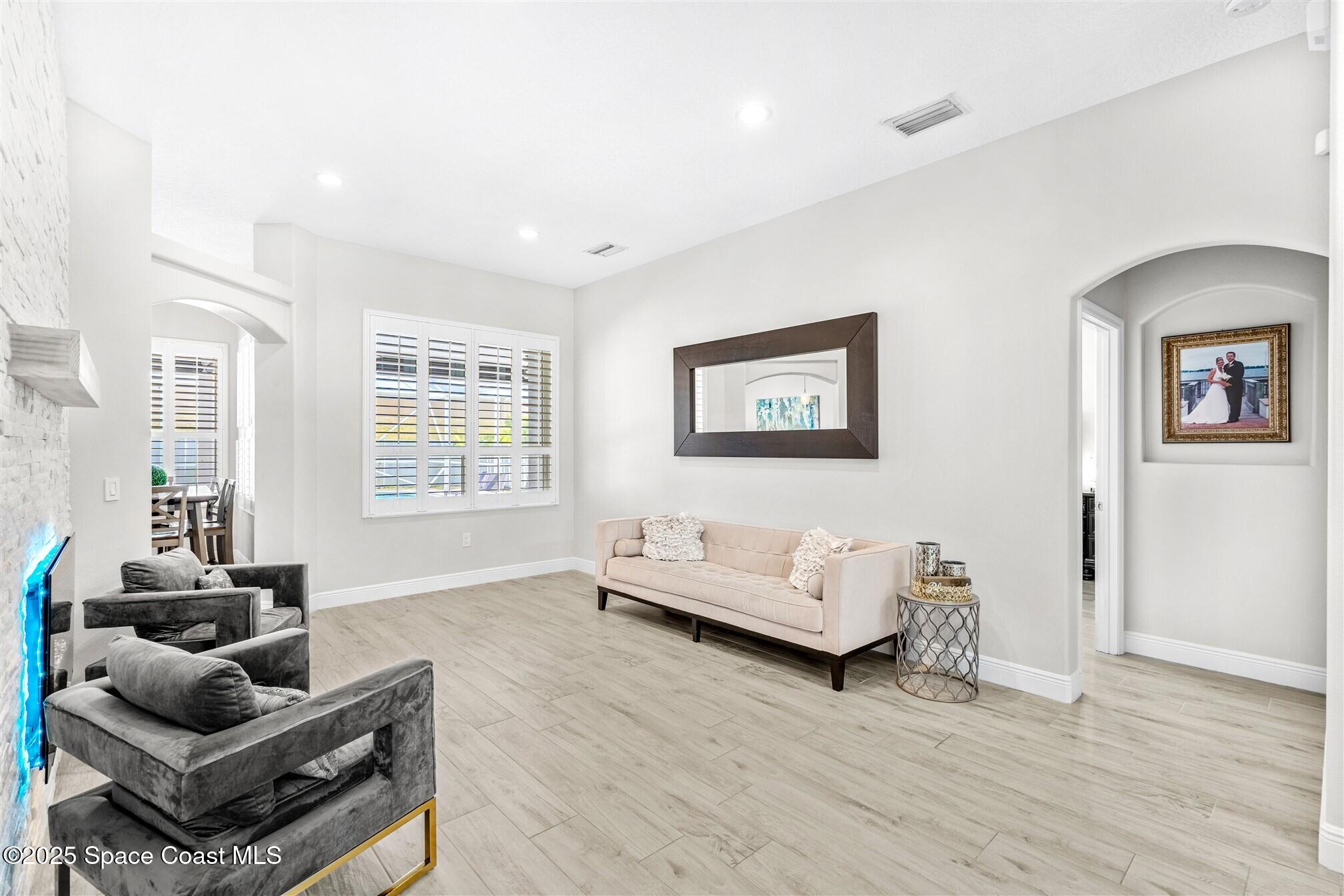 4440 Chardonnay Drive Rockledge, FL 32955 - Photo 6 of 41 a living room with furniture and a window