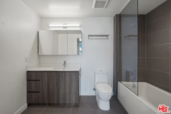 a bathroom with a toilet a sink and bathtub