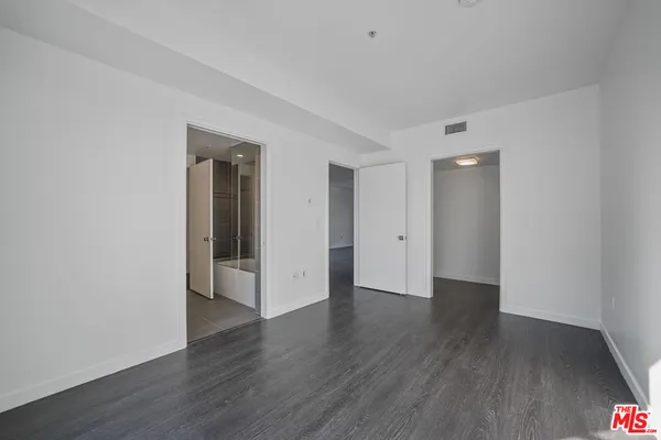 a view of a livingroom with wooden floor