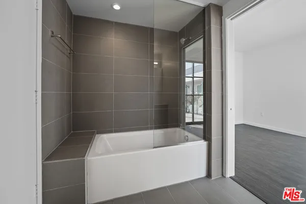 a white bath tub sitting in a bathroom