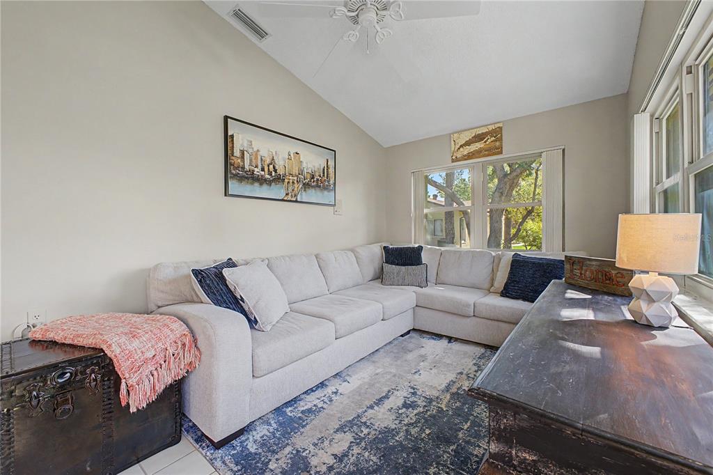 2662 Appleleaf Court Spring Hill, FL 34606 - Photo 28 of 47 a living room with furniture and a large window