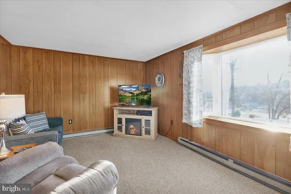 a living room with furniture and a window