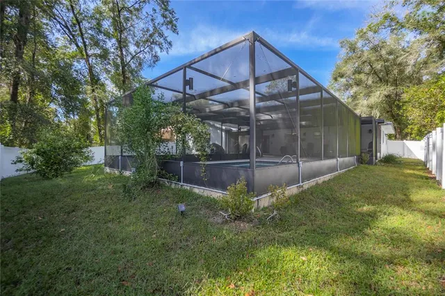 a view of a tiny house with a yard