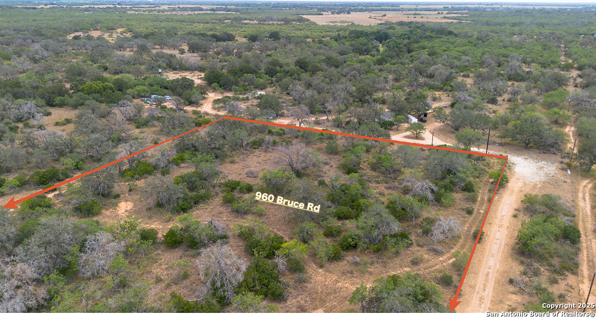 960 Bruce Road Poteet, TX 78065 - Photo 3 of 7 a view of a forest with a yard