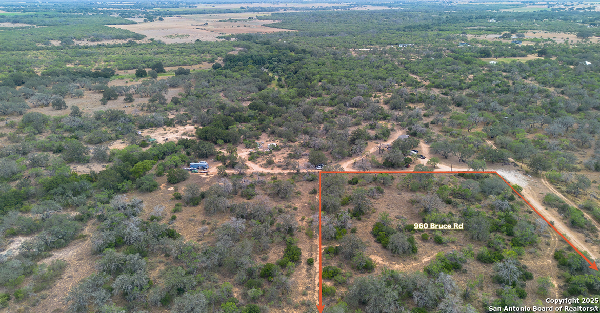 960 Bruce Road Poteet, TX 78065 - Photo 7 of 7 a view of a forest with a yard