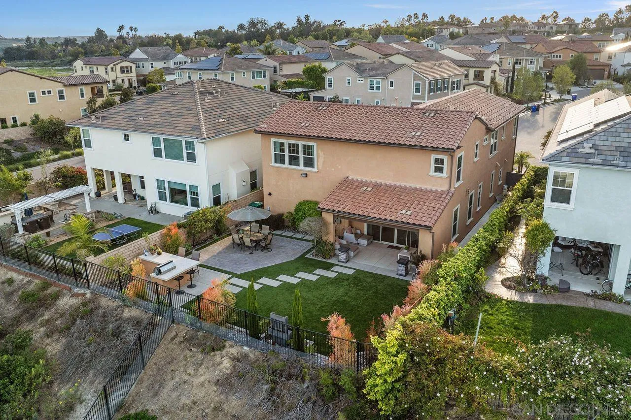 13509 Cielo Ranch Road San Diego, CA 92130 - Photo 12 of 54 an aerial view of multiple houses with a yard
