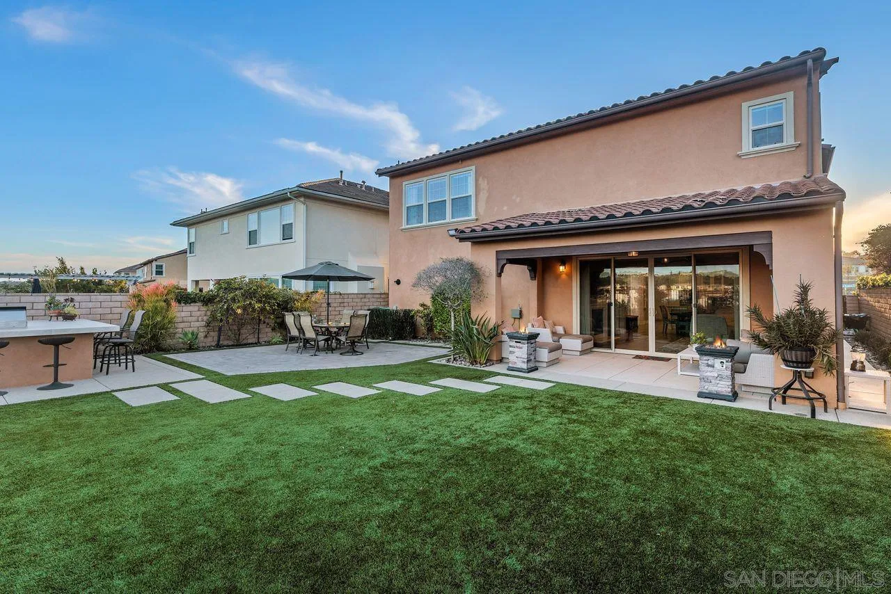 13509 Cielo Ranch Road San Diego, CA 92130 - Photo 16 of 54 a view of a house with a yard and furniture