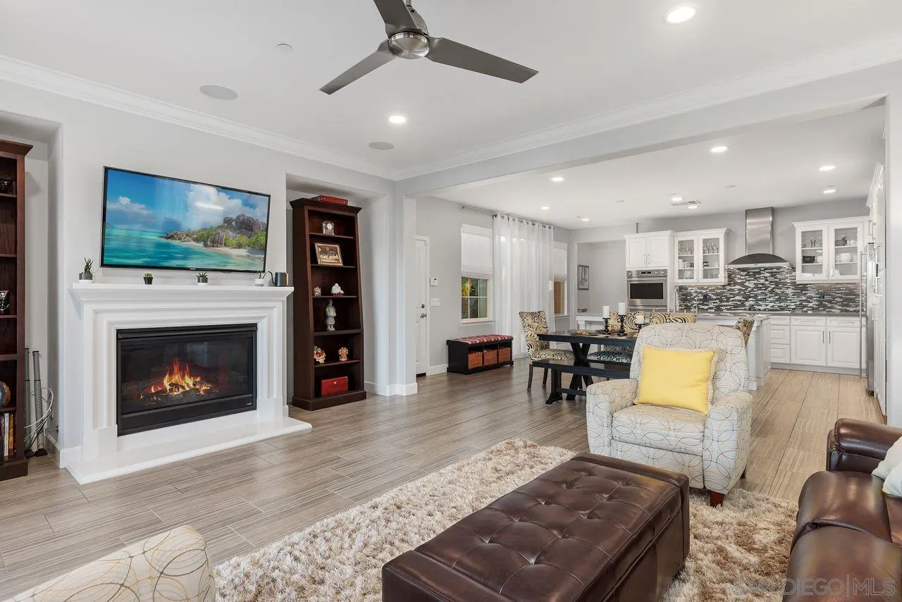 13509 Cielo Ranch Road San Diego, CA 92130 - Photo 20 of 54 a living room with furniture and a fireplace