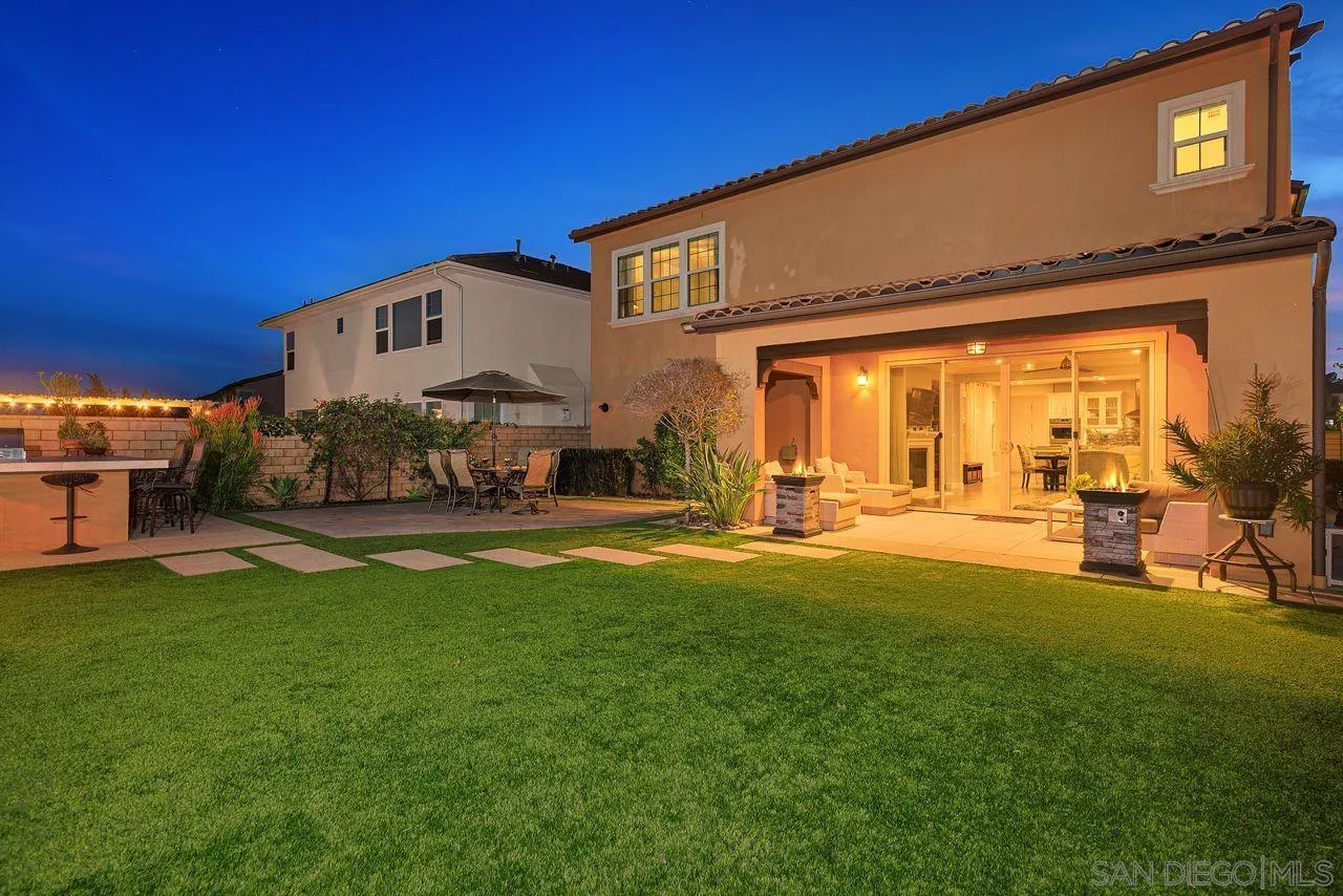 13509 Cielo Ranch Road San Diego, CA 92130 - Photo 2 of 54 a front view of a house with a yard
