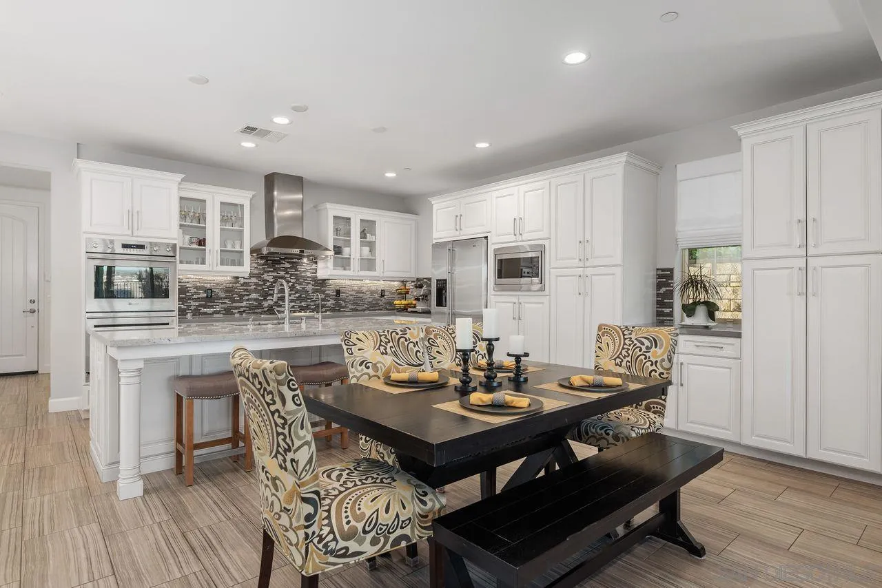 13509 Cielo Ranch Road San Diego, CA 92130 - Photo 21 of 54 a view of a dining room with furniture