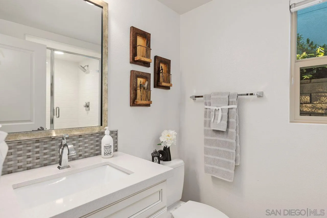 13509 Cielo Ranch Road San Diego, CA 92130 - Photo 27 of 54 a bathroom with a sink toilet and shower