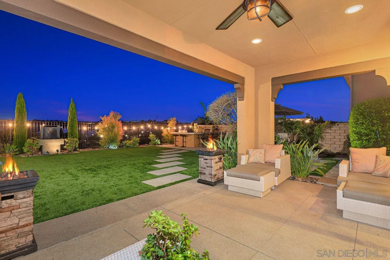 13509 Cielo Ranch Road San Diego, CA 92130 - Photo 3 of 54 a view of a patio with couches table and chairs with garden view