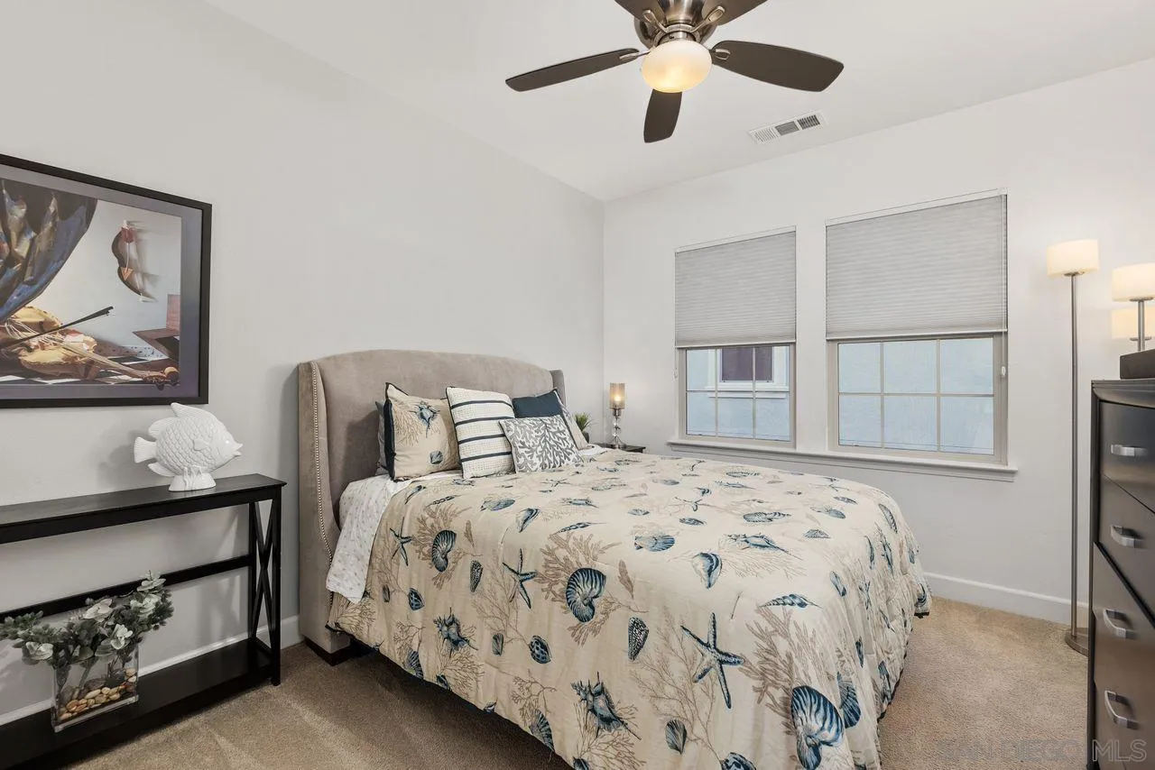 13509 Cielo Ranch Road San Diego, CA 92130 - Photo 36 of 54 a bedroom with a bed and a painting on the wall