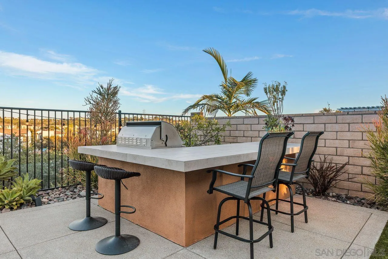 13509 Cielo Ranch Road San Diego, CA 92130 - Photo 38 of 54 a view of a table and chairs in patio
