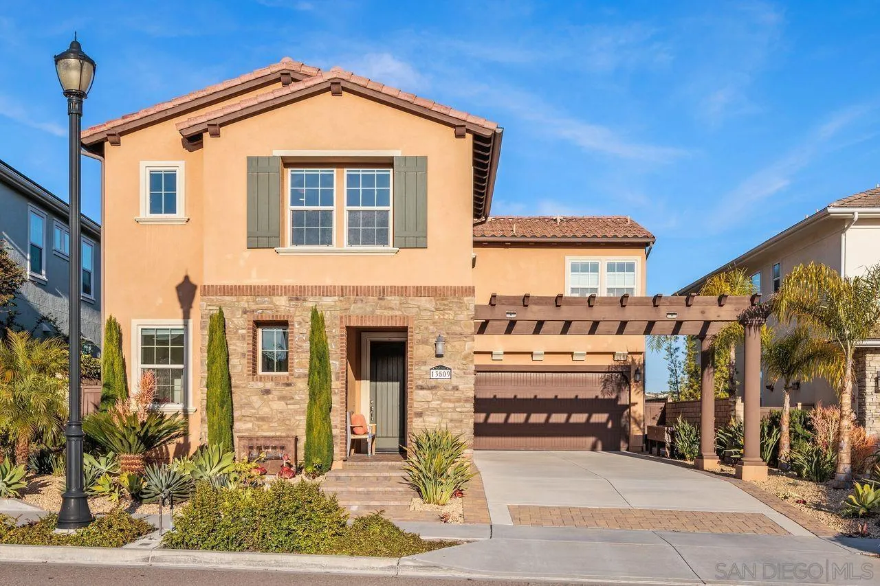 13509 Cielo Ranch Road San Diego, CA 92130 - Photo 48 of 54 a front view of a house with a yard