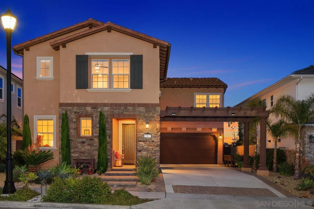 13509 Cielo Ranch Road San Diego, CA 92130 - Photo 5 of 54 a front view of a house with large windows
