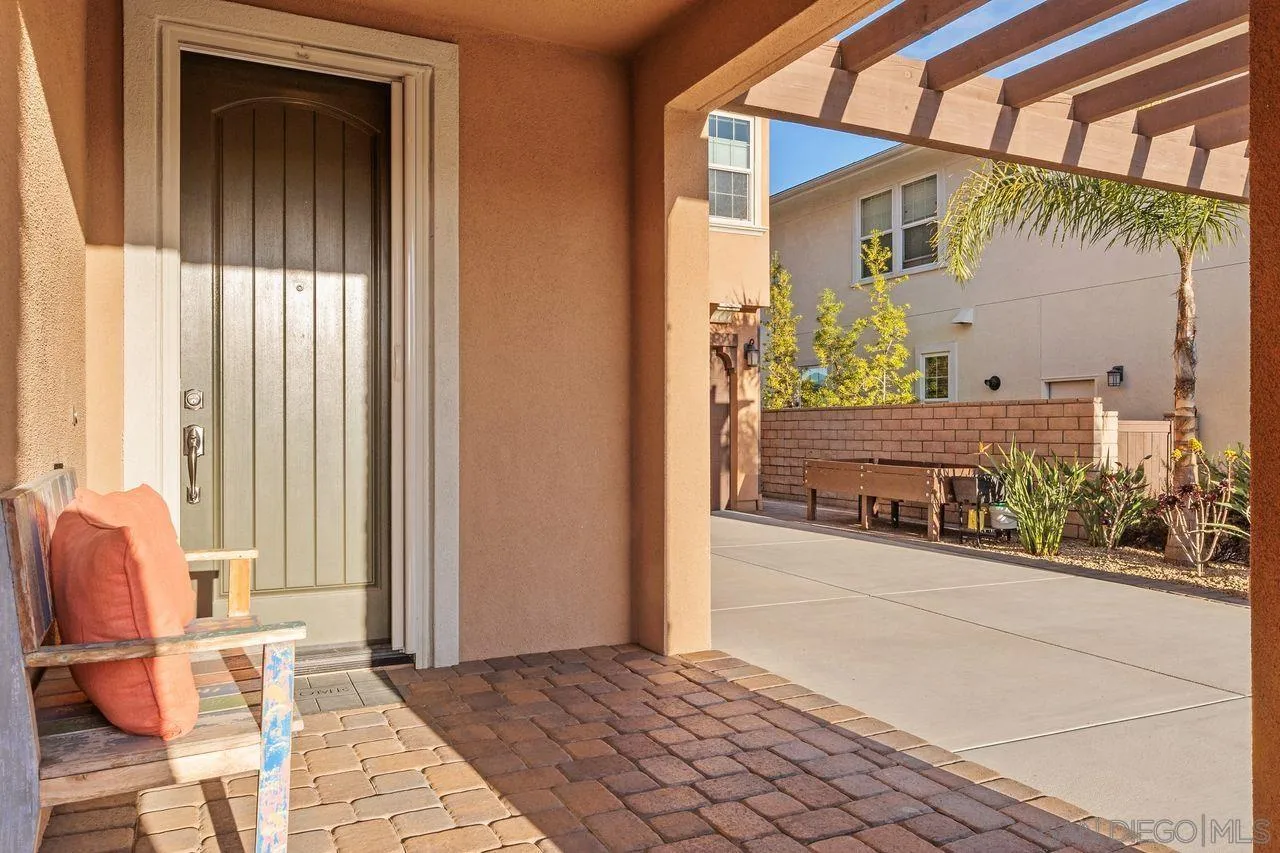 13509 Cielo Ranch Road San Diego, CA 92130 - Photo 52 of 54 a view of a entryway door of the house and living room