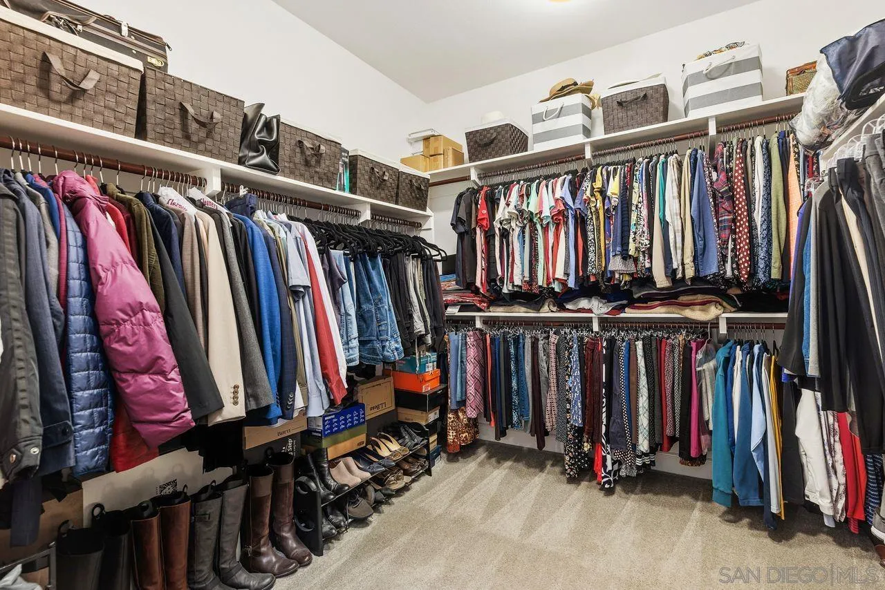 13509 Cielo Ranch Road San Diego, CA 92130 - Photo 54 of 54 a view of walk in closet with clothes