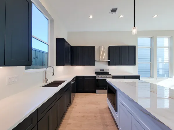 a large kitchen with a large counter top
