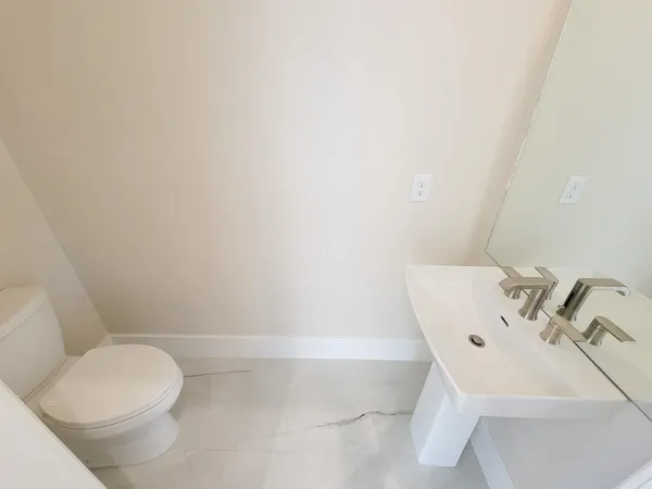 a bathroom with a sink and toilet