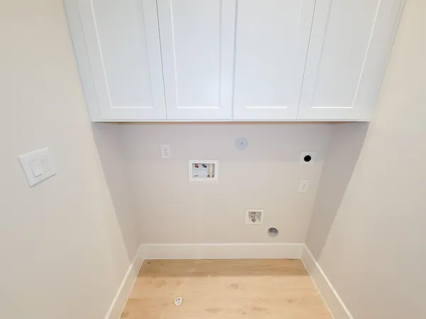 a utility room with cabinets