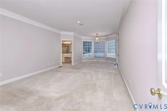 an empty room with a empty space and windows