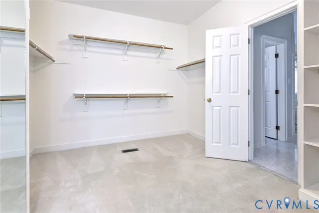 a view of an empty walk in closet