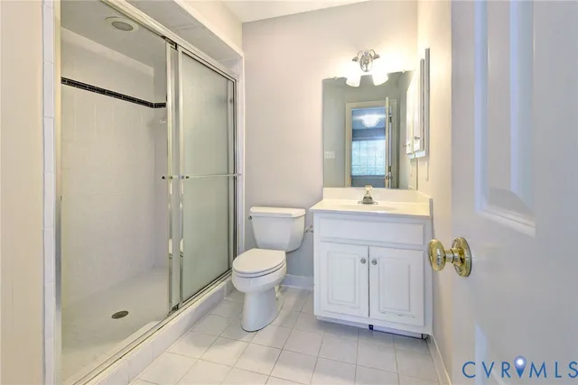 a bathroom with a toilet a sink and a mirror