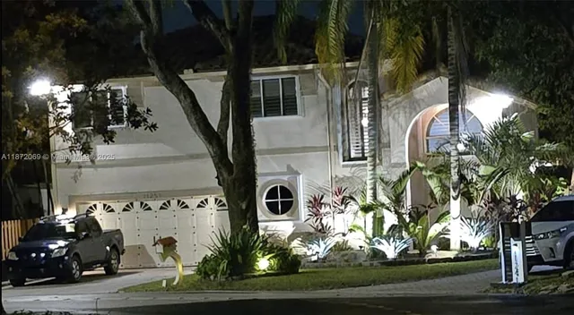 a bathroom with a sink vanity mirror and toilet