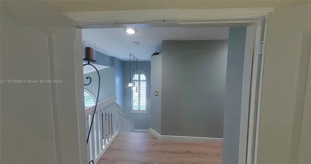 a kitchen with a refrigerator a stove top oven a sink and dishwasher