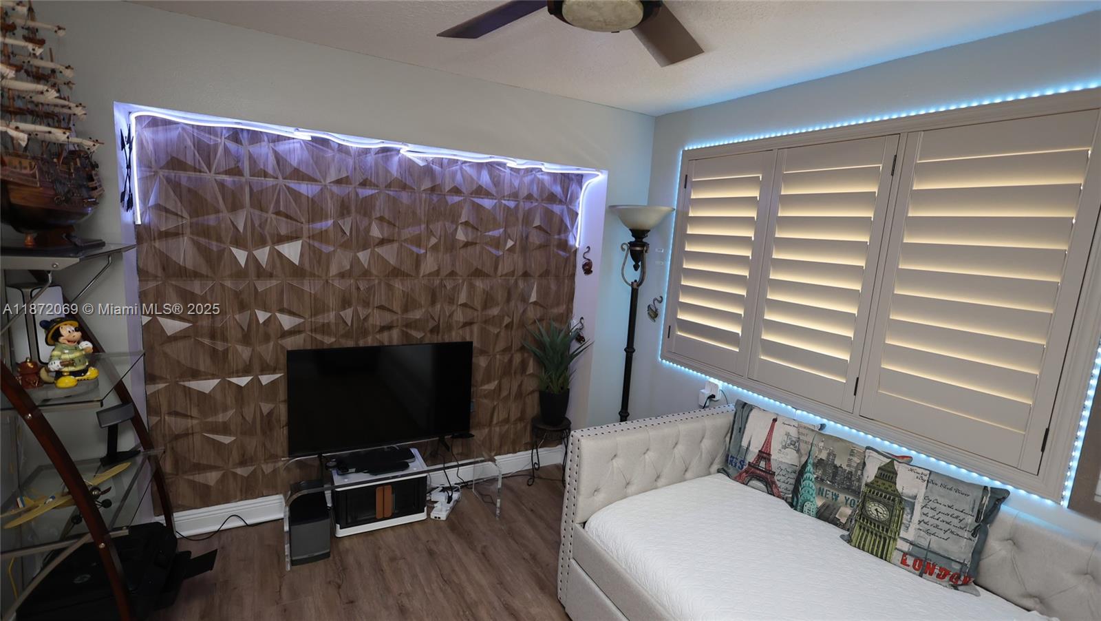 11251 Reveille Road Cooper City, FL 33026 - Photo 18 of 82 a living room with furniture and a fireplace