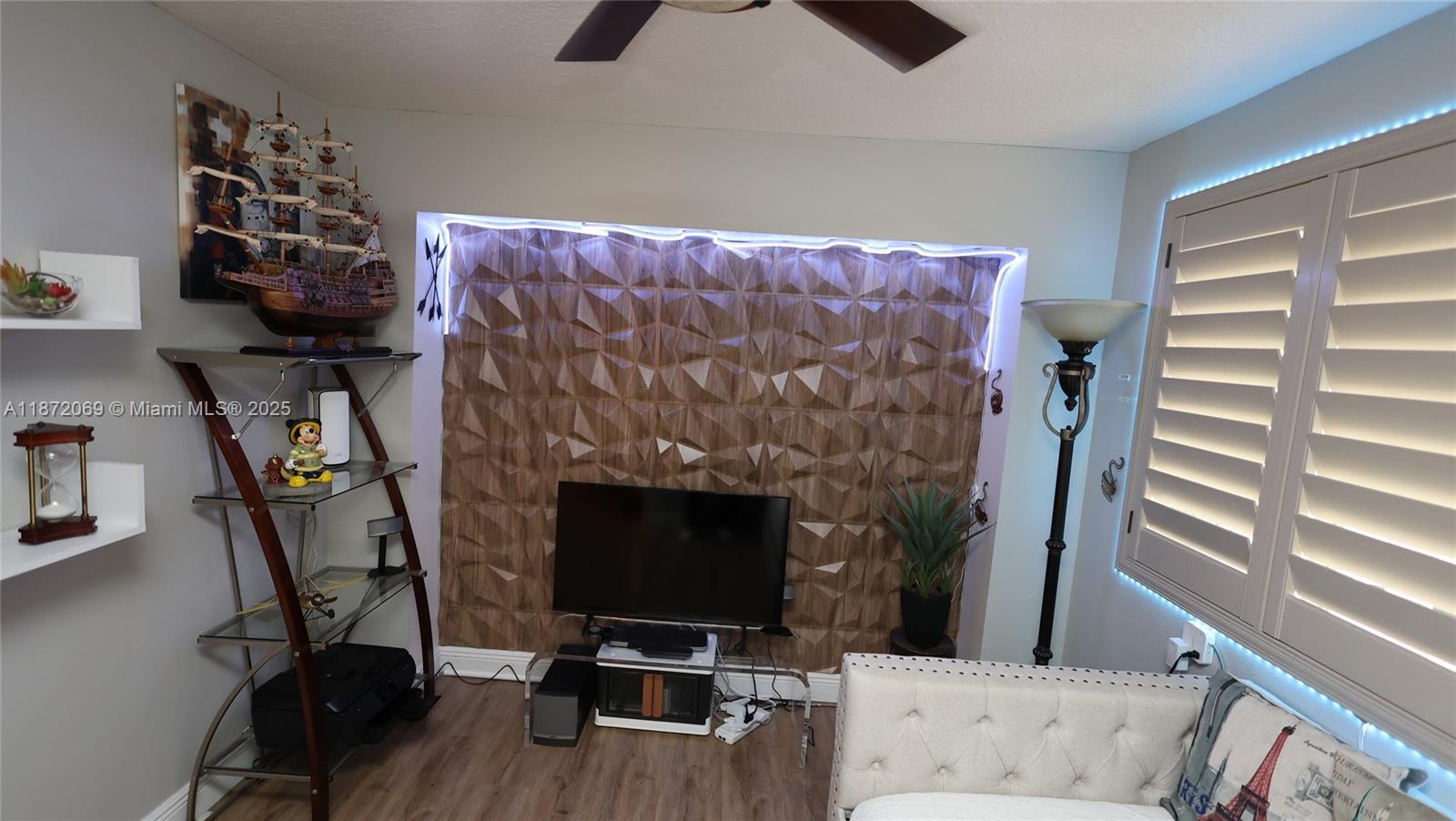 11251 Reveille Road Cooper City, FL 33026 - Photo 21 of 82 a living room with furniture and a fireplace