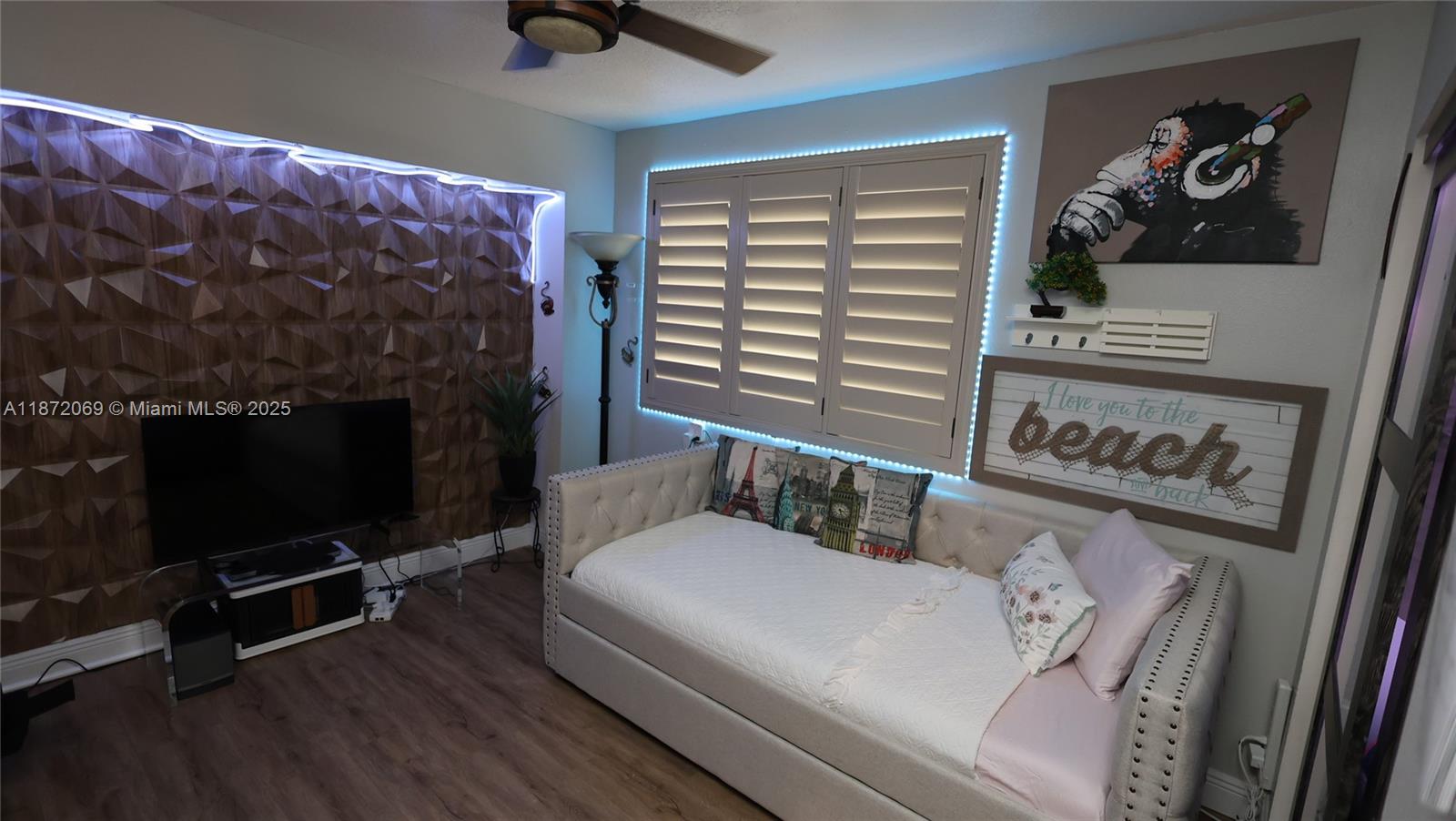 11251 Reveille Road Cooper City, FL 33026 - Photo 22 of 82 a living room with furniture and a fireplace