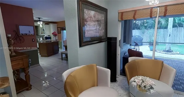 a view of a chairs and tables in the balcony
