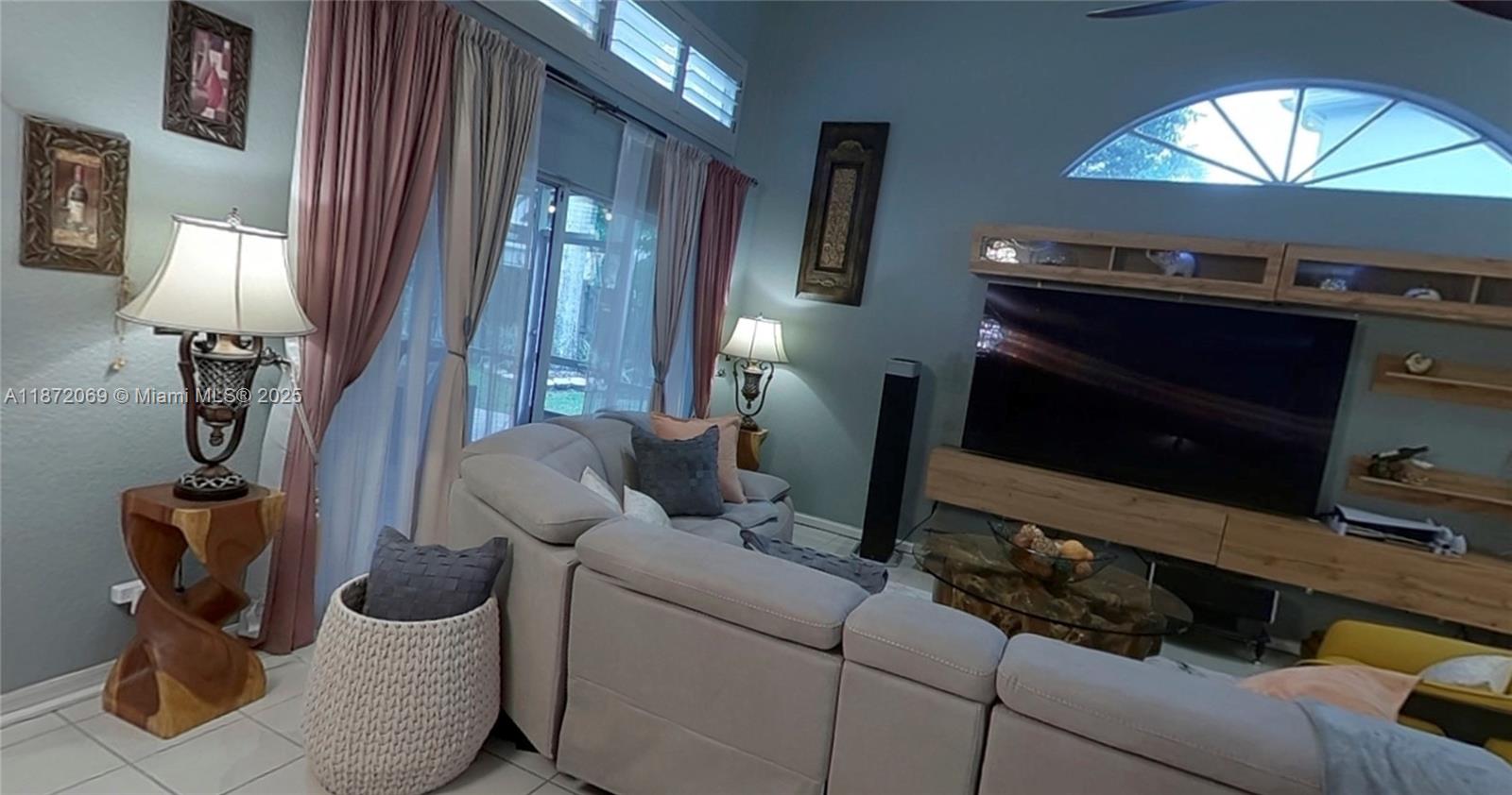 11251 Reveille Road Cooper City, FL 33026 - Photo 28 of 82 a living room with furniture and a fireplace