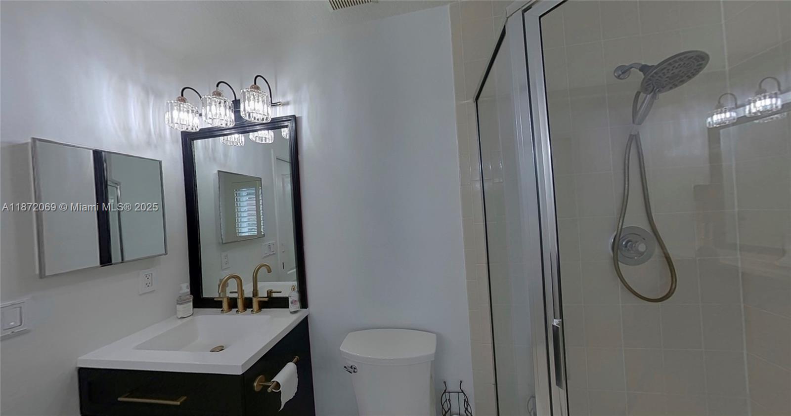 11251 Reveille Road Cooper City, FL 33026 - Photo 6 of 82 a bathroom with a sink vanity mirror and toilet