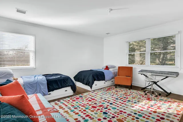 a bedroom with furniture and a window