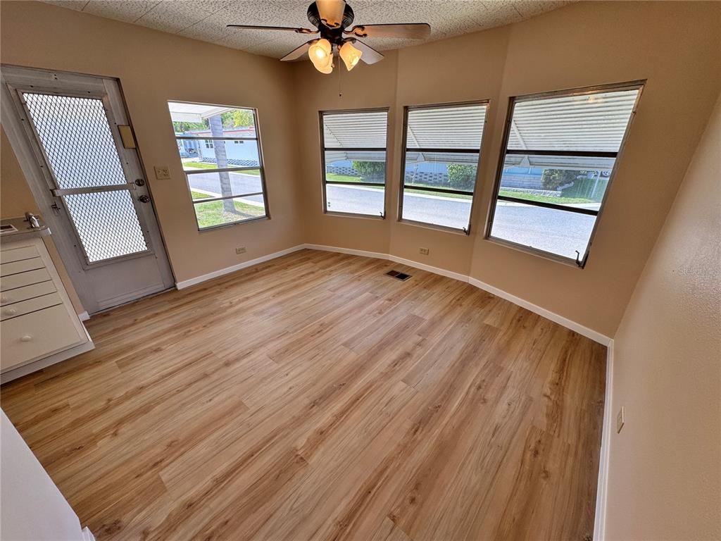 2331 Belleair Road, Unit LOT 237 Clearwater, FL 33764 - Photo 12 of 33 wooden floor in an empty room with a window