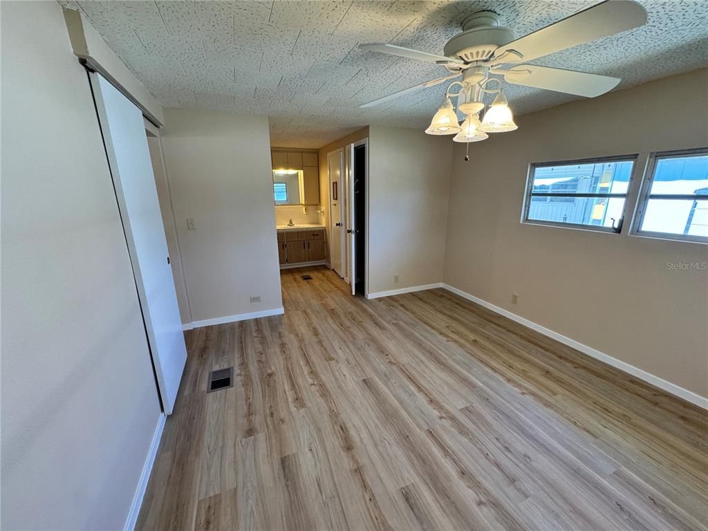 2331 Belleair Road, Unit LOT 237 Clearwater, FL 33764 - Photo 13 of 33 wooden floor in an empty room with a window