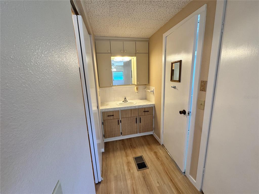 2331 Belleair Road, Unit LOT 237 Clearwater, FL 33764 - Photo 15 of 33 a bathroom with a sink and a mirror