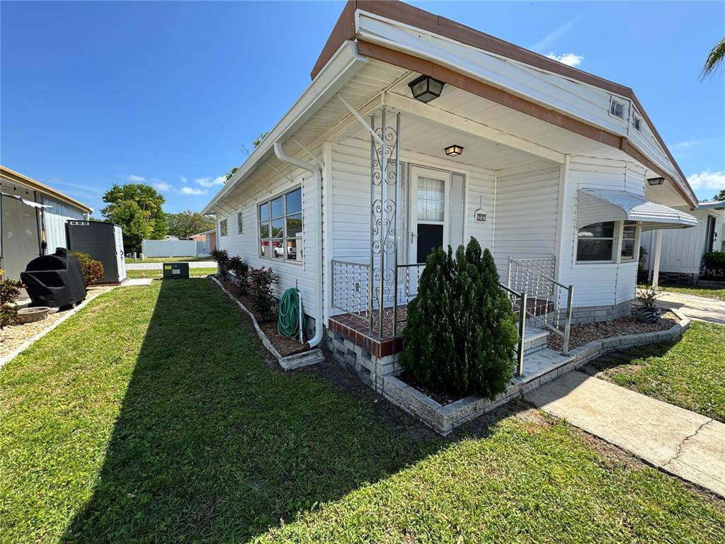 2331 Belleair Road, Unit LOT 237 Clearwater, FL 33764 - Photo 2 of 33 a view of a house with backyard