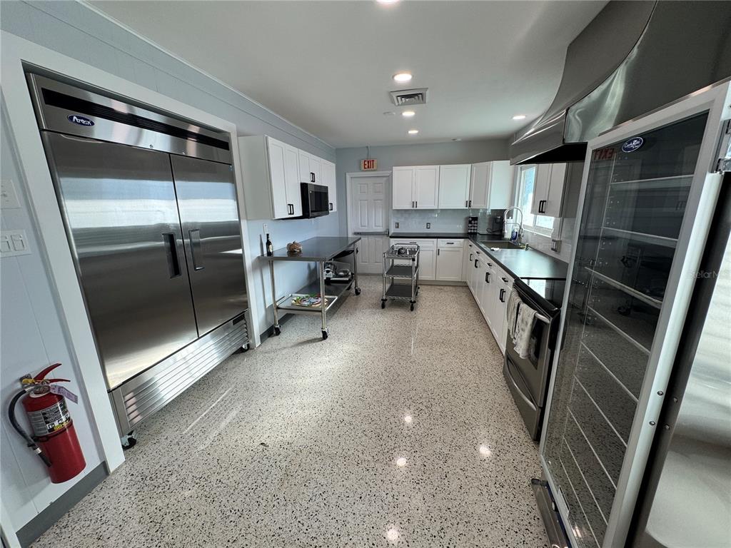 2331 Belleair Road, Unit LOT 237 Clearwater, FL 33764 - Photo 30 of 33 a living room with stainless steel appliances furniture and a rug