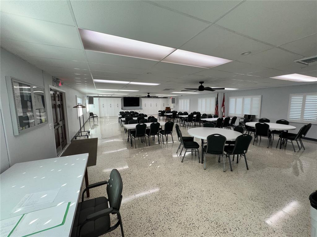 2331 Belleair Road, Unit LOT 237 Clearwater, FL 33764 - Photo 32 of 33 a group of people sitting in a living room