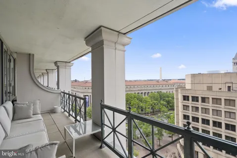 a view of a balcony with furniture