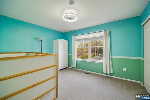 a view of room with window and hallway