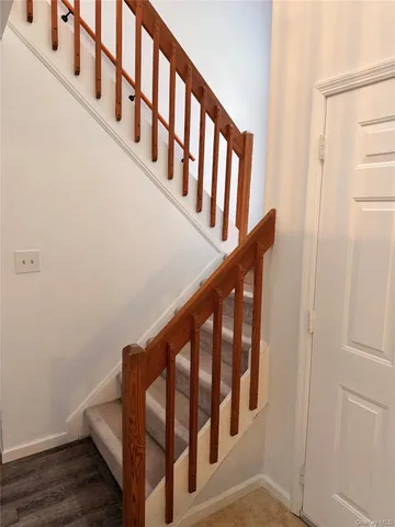 a view of entryway with wooden floor